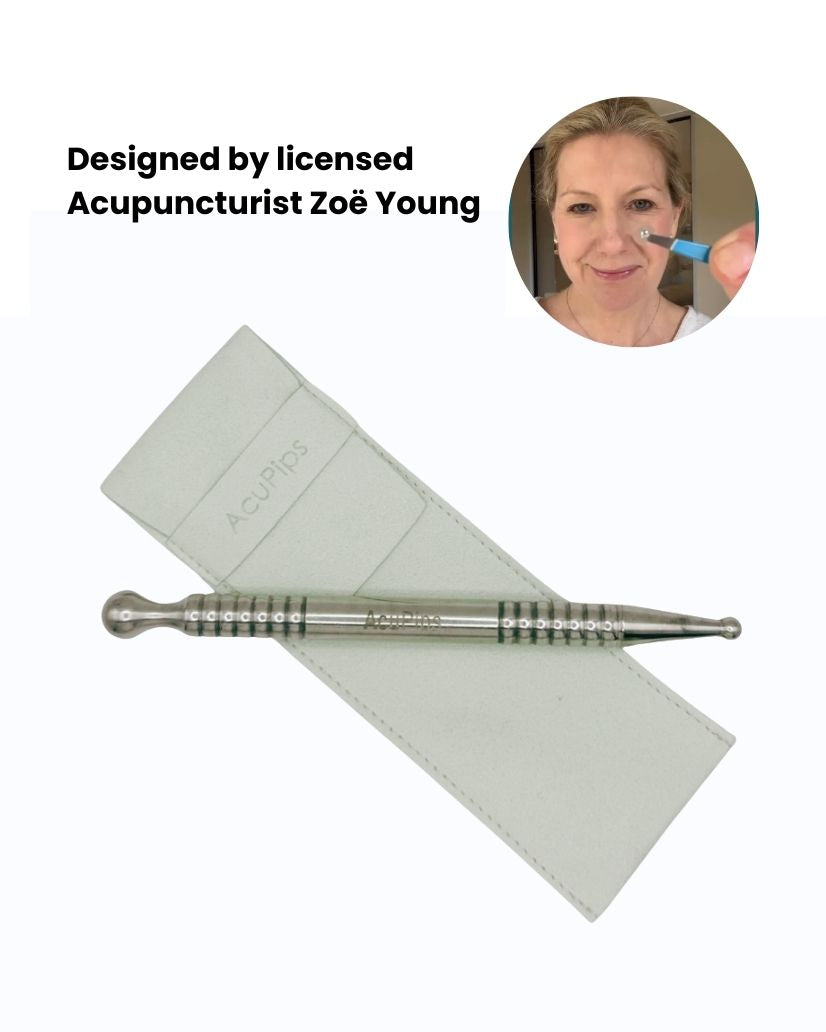Acupuncture needle and card on a white background, designed by licensed acupuncturist Zoe Young.